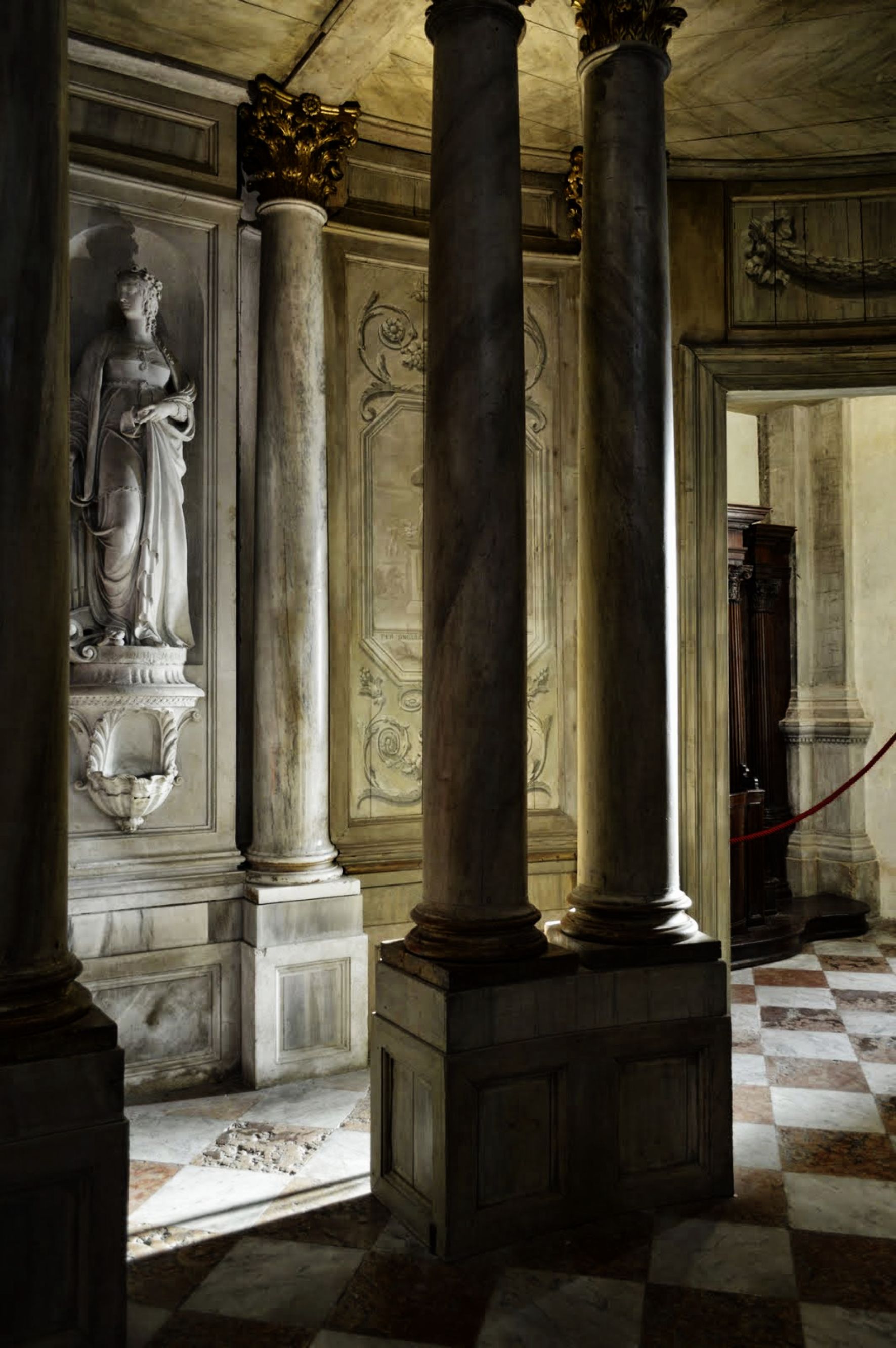 Classical marble interior with columns and statuary
